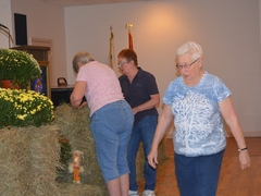 Decorating the straw bales.